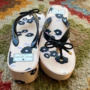 Kate Spade floral flips flops. Size: 7